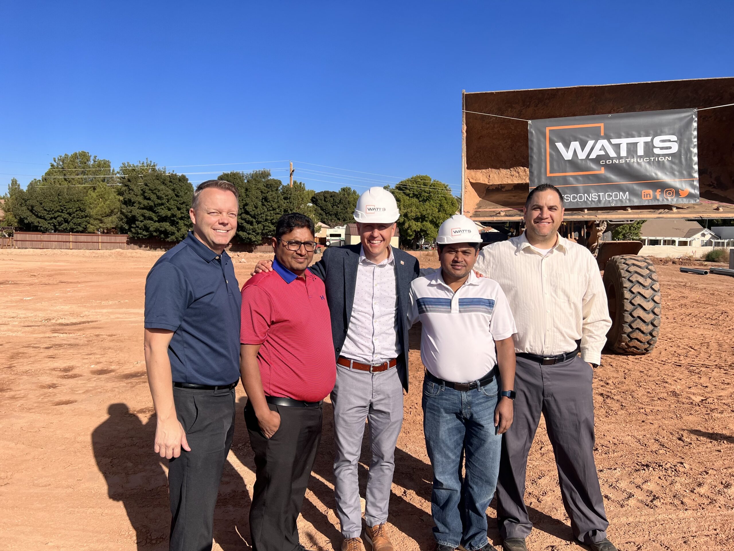 Building owners and Mayor Staheli posing for a picture. 