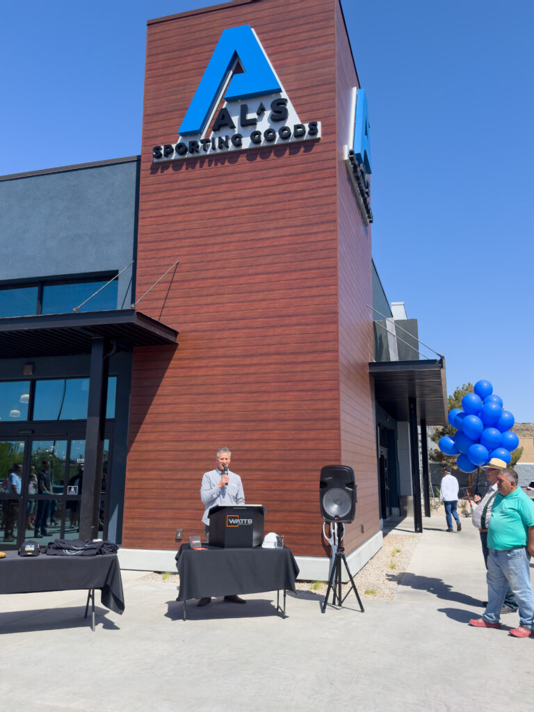 Kris Larsen speaking to the ribbon cutting crowd