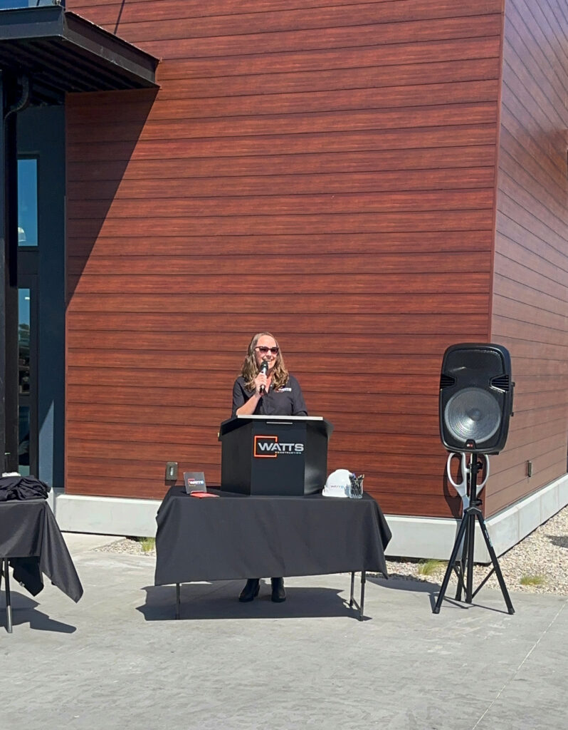 Annie Howell speaking to the ribbon cutting crowd