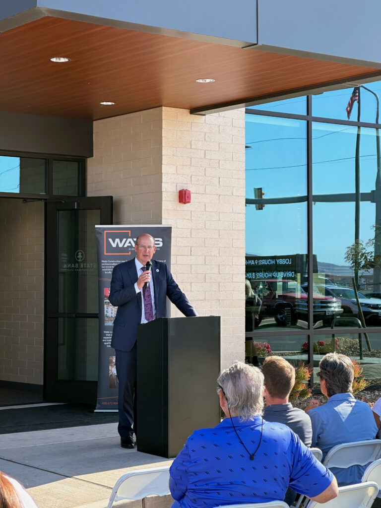 Eric Schmutz speaking at podium