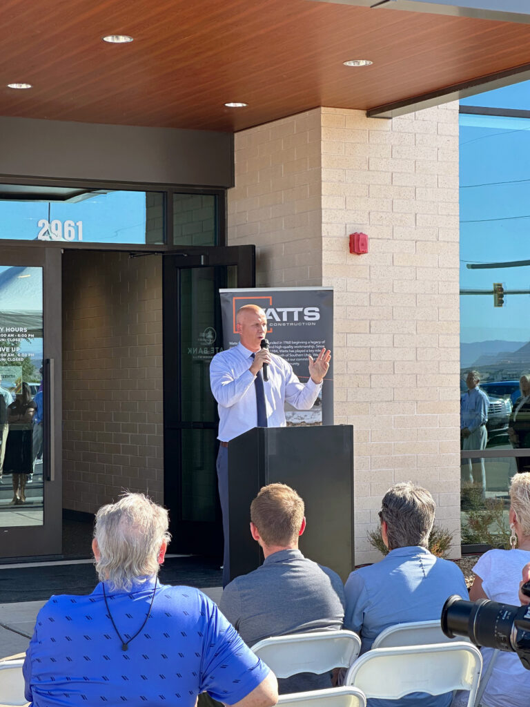 Scott Gilberg speaking at the podium